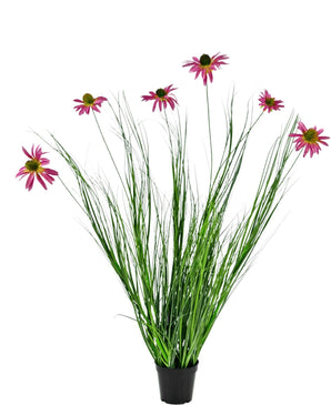 Konstgräsväxten Chrysanthemum 100 cm brandskyddsmedel är en krukväxt med långa gröna blad och långa stjälkar toppade med ljusrosa tusenskönaliknande blommor, mot en vit bakgrund.