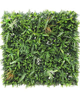 Artificiell Hedge Savanne brandskyddsmedel 100x100 cm är en fyrkantig panel med tätt, brandskyddande konstgjorda gröna bladverk med blandade växtblad som ormbunkar och gräs för en frodig vertikal trädgårdseffekt.