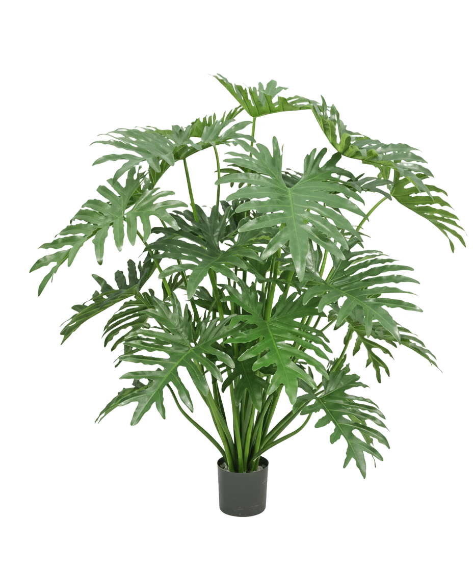 En konstgjord växt Philodendron 125 cm med stora, gröna, djupt kluvna blad mot vit bakgrund.