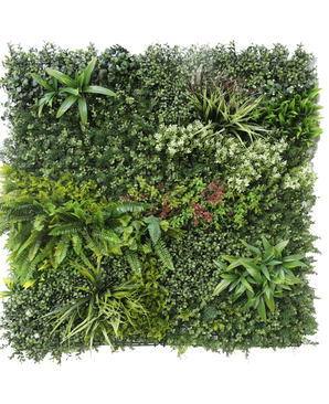 Artificiell Hedge Prestige 100x100 cm UV är en fyrkantig panel av konstgjorda gröna bladverk med blandade bladväxter, ormbunkar, varierande texturer och gröna nyanser, plus klasar av små vita och röda blommor. Bakgrunden är vit.